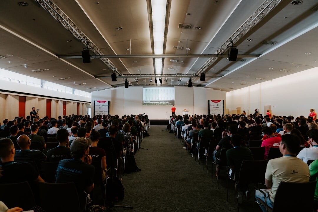 Large audience listening attentively at a business conference