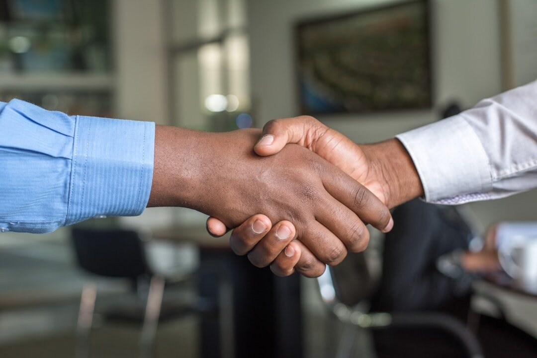 Two business people shaking hands after a successful discussion